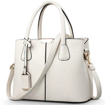 Elegante leren schoudertas voor dames, stijlvol en ruim, met verstelbare riem en verschillende kleurkeuzes.