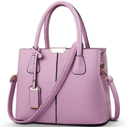 Elegante leren schoudertas voor dames, stijlvol en ruim, met verstelbare riem en verschillende kleurkeuzes.