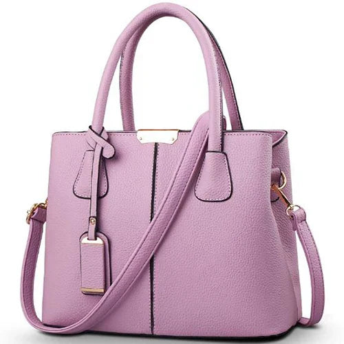 Elegante leren schoudertas voor dames, stijlvol en ruim, met verstelbare riem en verschillende kleurkeuzes.