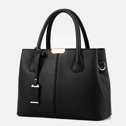 Elegante leren schoudertas voor dames, stijlvol en ruim, met verstelbare riem en verschillende kleurkeuzes.