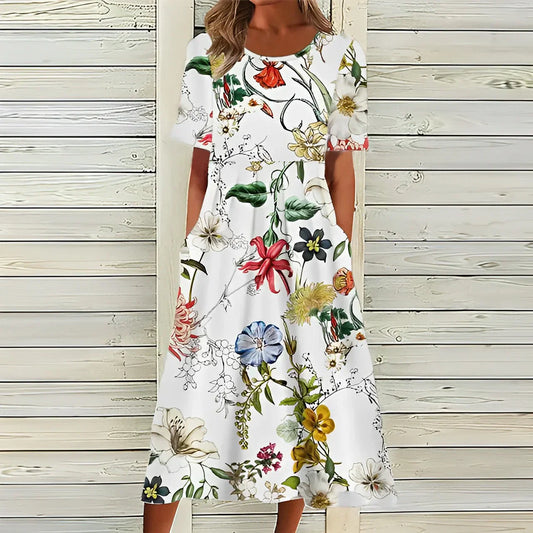 "Elegante Liva Midi-Jurk met luchtige stof en bloemenmotief; perfecte zomerse jurk voor elke gelegenheid."
