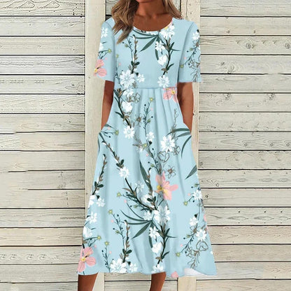 "Elegante Liva Midi-Jurk met luchtige stof en bloemenmotief; perfecte zomerse jurk voor elke gelegenheid."