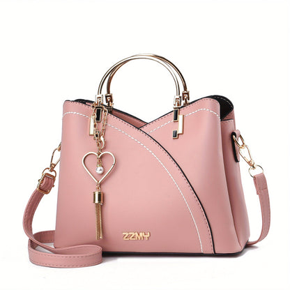 "Elegante luxe leren handtas met stijlvol kleurblokontwerp en kwastjes, perfect voor de moderne vrouw, frontaal gezien."