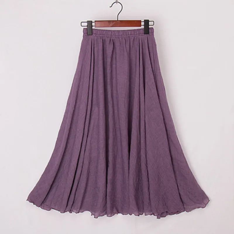 "Elegante maxi-rok van zachte katoen in een neutrale tint, met hoge taille, perfect voor dagelijks en avondgebruik."