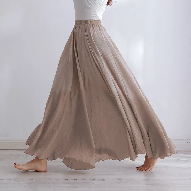 "Elegante maxi-rok van zachte katoen in een neutrale tint, met hoge taille, perfect voor dagelijks en avondgebruik."