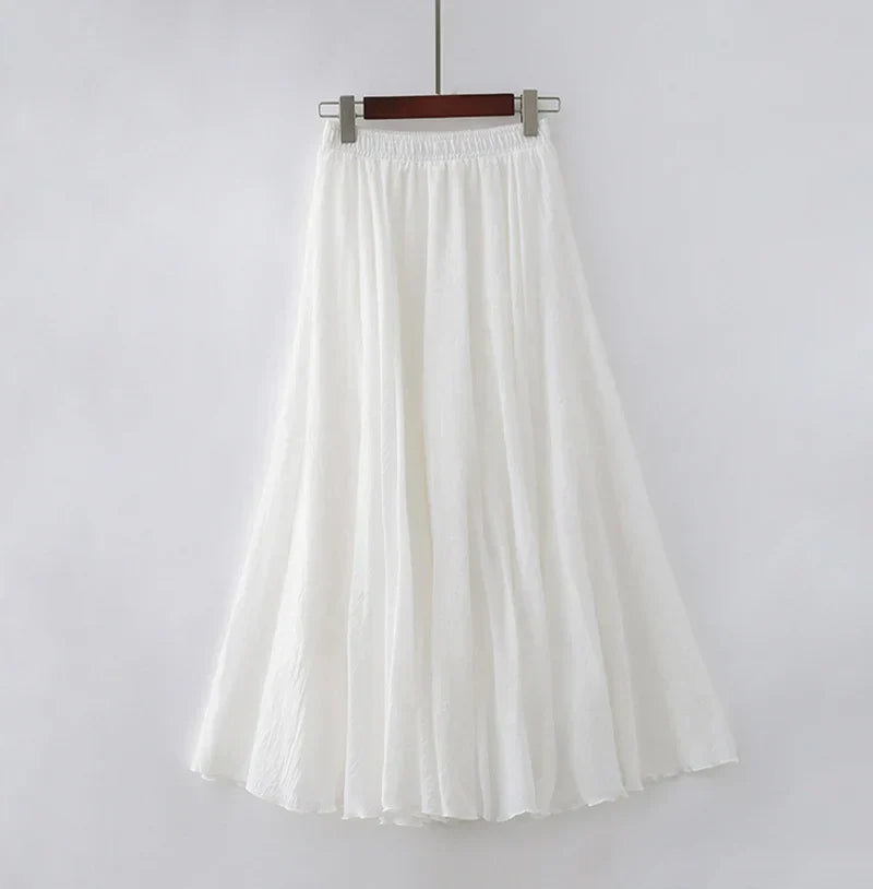 "Elegante maxi-rok van zachte katoen in een neutrale tint, met hoge taille, perfect voor dagelijks en avondgebruik."