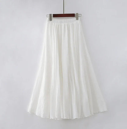 "Elegante maxi-rok van zachte katoen in een neutrale tint, met hoge taille, perfect voor dagelijks en avondgebruik."