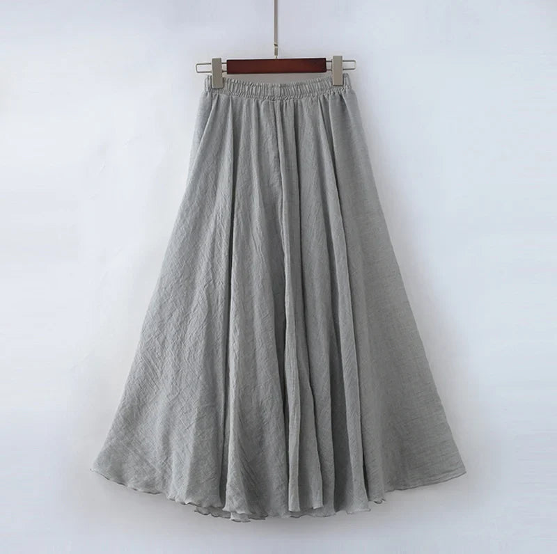 "Elegante maxi-rok van zachte katoen in een neutrale tint, met hoge taille, perfect voor dagelijks en avondgebruik."