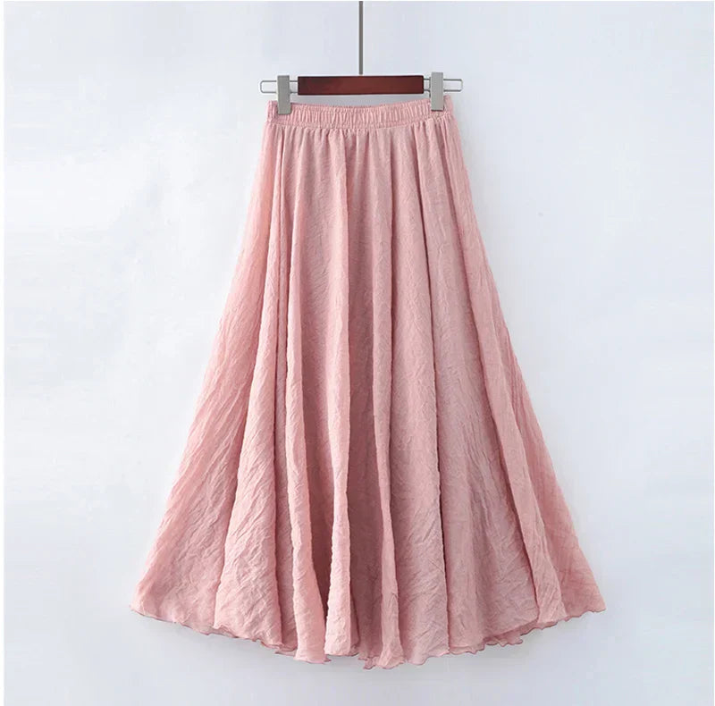 "Elegante maxi-rok van zachte katoen in een neutrale tint, met hoge taille, perfect voor dagelijks en avondgebruik."