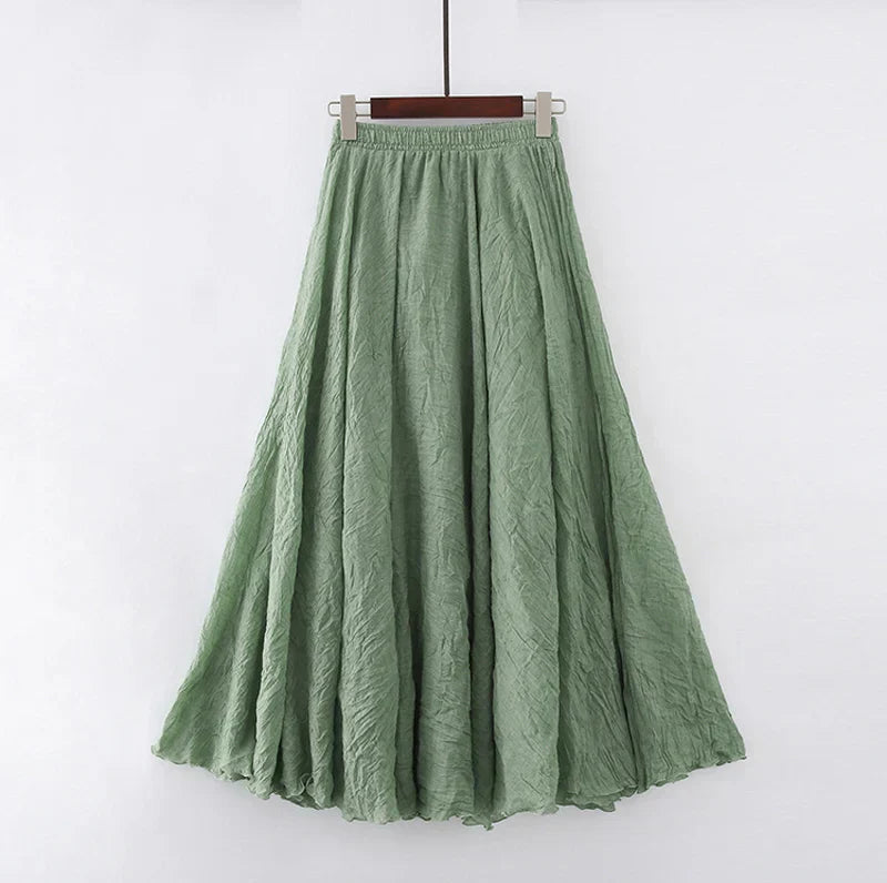 "Elegante maxi-rok van zachte katoen in een neutrale tint, met hoge taille, perfect voor dagelijks en avondgebruik."