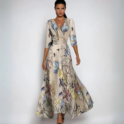 Elegante Noa luxe jurk met bloemenprint en verstelbare tailleband, zijaanzicht, ideaal voor formele en casual gebruik.