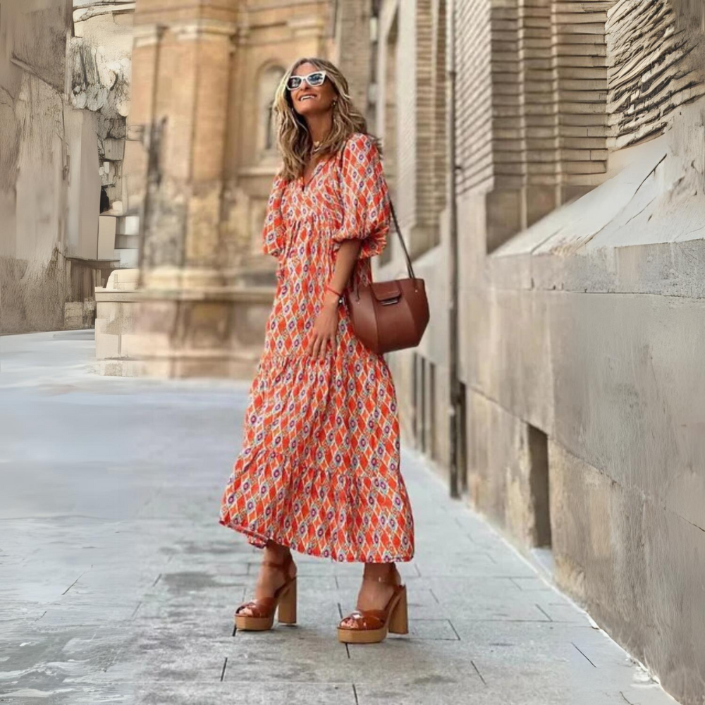 "Elegante Paris zomerjurk, midi lengte met frisse patronen, knoopdetails en luchtige mouwen voor zomerse dagen."