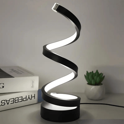 "Elegante spiraal LED tafellamp, modern design, dimbaar, staat op tafel met helder licht en stijlvol, eigentijds ontwerp."