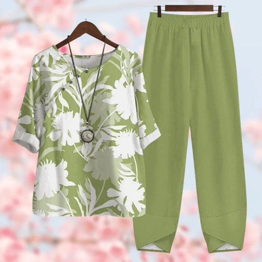 Elegante tweedelige set met vintage bloemenprint, losse top met korte mouwen en high-waist broek, stijlvol en comfortabel.