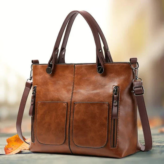 "Elegante vintagestijl leren schoudertas voor dames met bruine tinten, perfect voor een klassieke en tijdloze look."