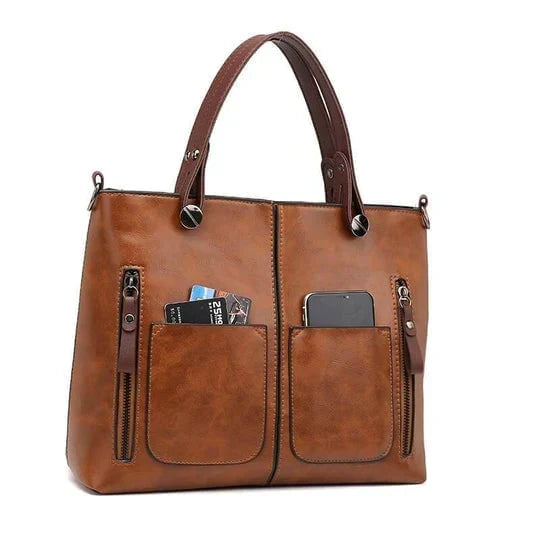 Zwarte leren dames handtas met vintage flair. Elegante schoudertas, perfect voor modebewuste vrouwen.
