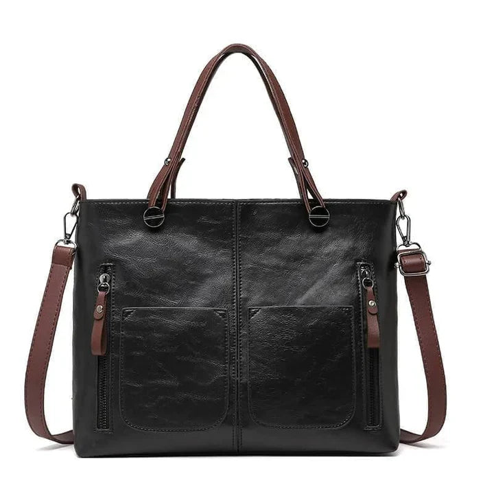Bruine leren vintage schoudertas voor dames, met verstelbare riem. Elegant en tijdloos mode accessoire.