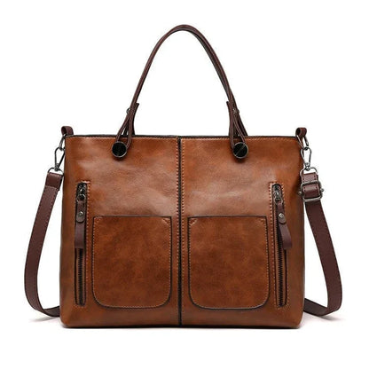 "Elegante vintagestijl leren schoudertas voor dames met bruine tinten, perfect voor een klassieke en tijdloze look."