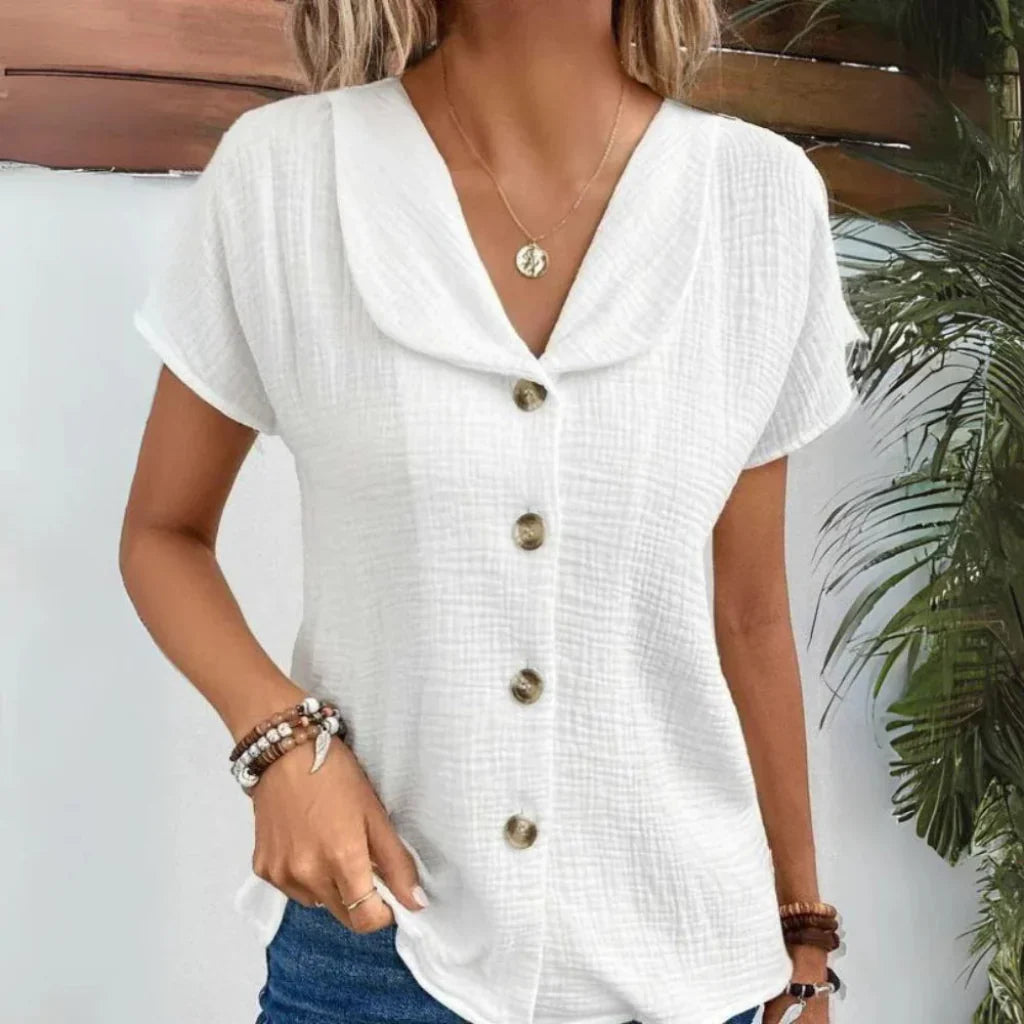 Elegante dames zomerblouse met V-hals en driekwartmouw, ideaal voor lente en zomer. Comfortabele pasvorm.