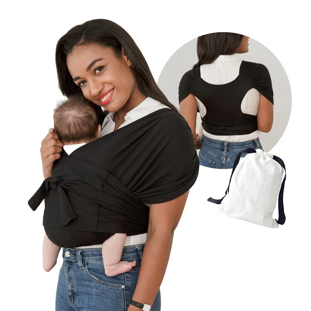Ouder lacht naar baby in comfortabele draagdoek, bevordert ouder-kind binding en veiligheid.