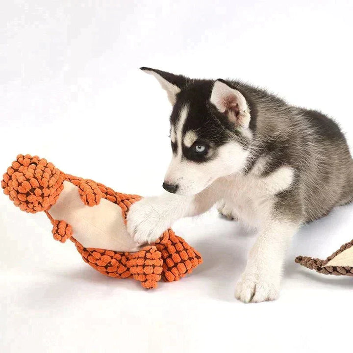 Kleurrijk (groen/oranje/bruin) dino speelgoed voor honden, gemaakt van duurzaam en sterk rubber.