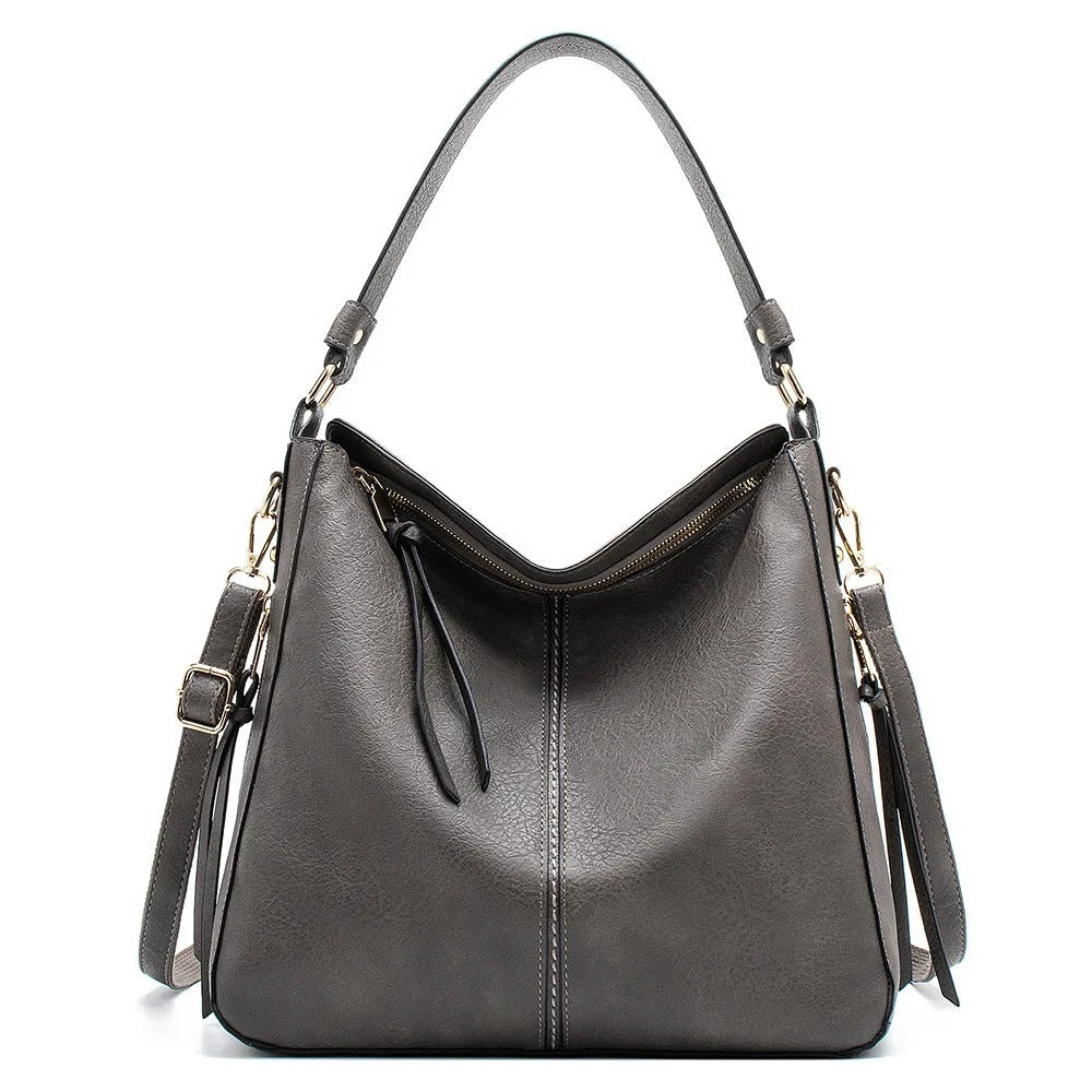 Moderne functionele dames crossbody tas; tijdloze elegantie, perfect als schoudertas accessoire.