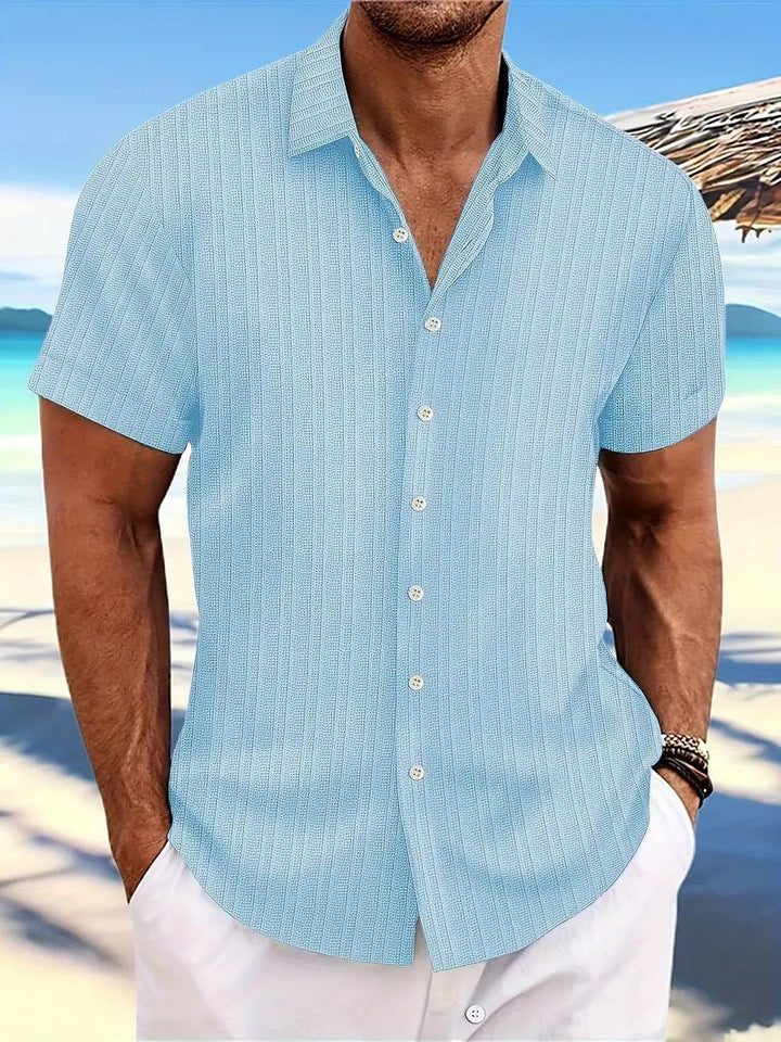 Stijlvol herenoverhemd met korte mouwen. Comfortabele kleding voor de zomer, strand & vakantie.