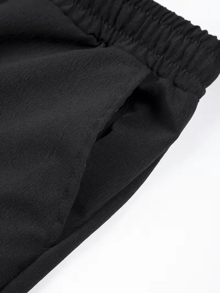 Witte plissé shorts, heren zomerkleding, met comfortabele elastische tailleband.