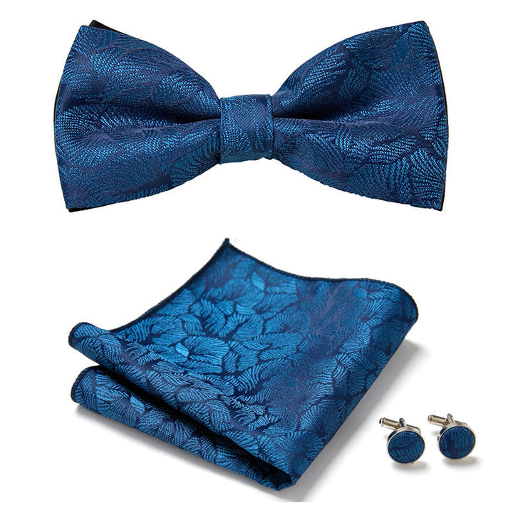 Stijlvolle heren vlinderstrik met elegant bloemenpatroon, pochet & manchetknopen. Ideaal voor feestelijke outfits.