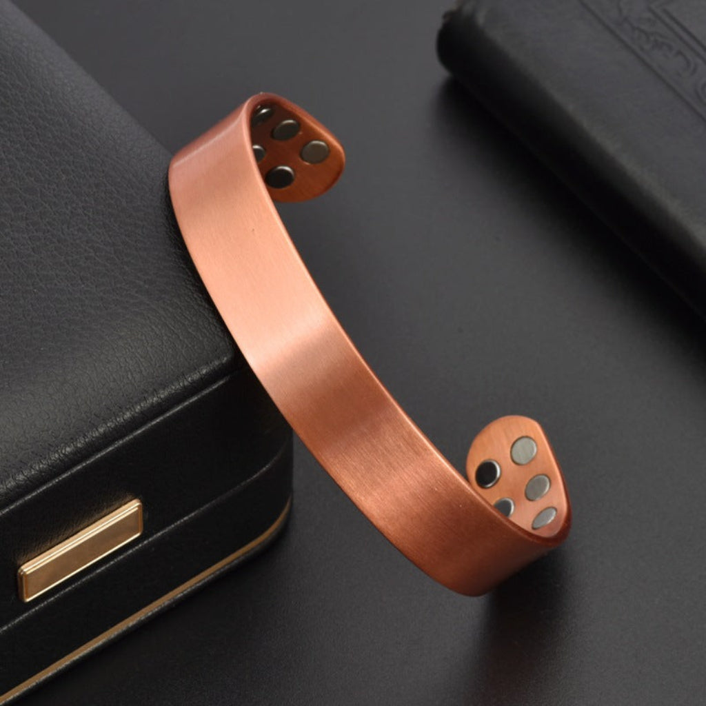 Unisex koperen sieradenset met magnetische armband en ring. Elegant en verstelbaar roodkoperen cadeau.
