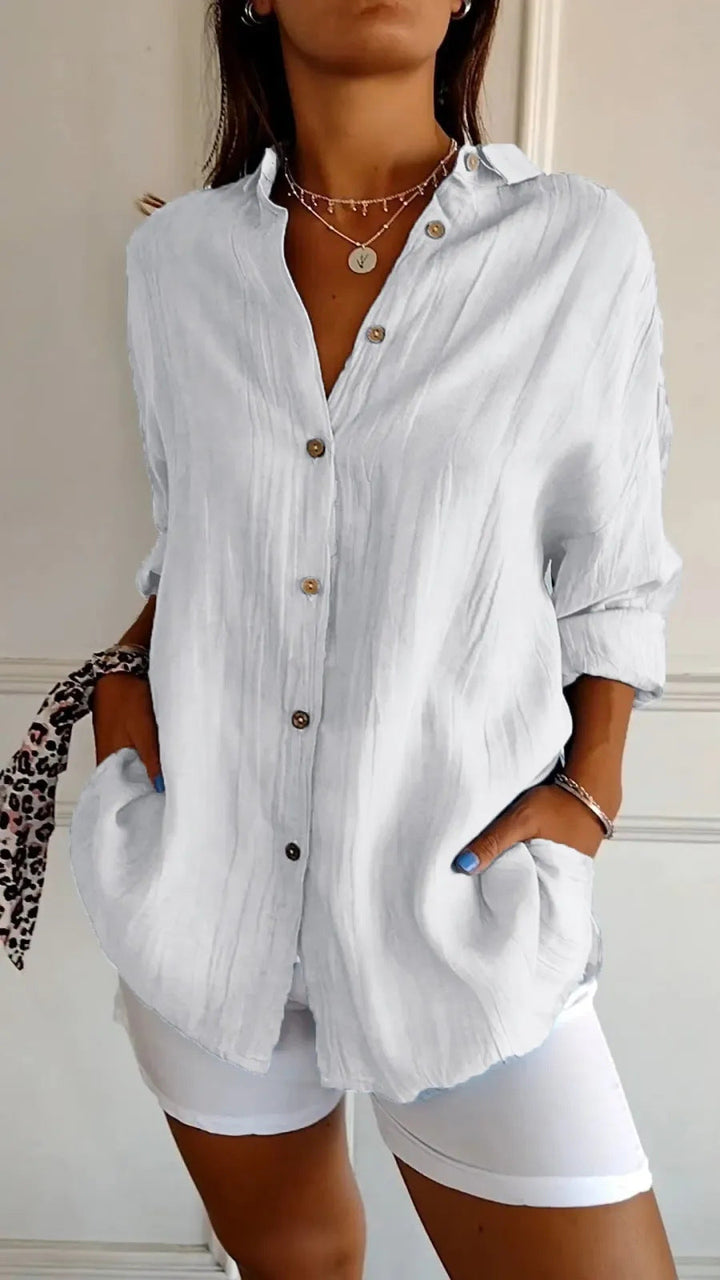 Dames plooitop met chique reverskraag en lange mouwen. Elegante effen blouse, ook in grote maten.