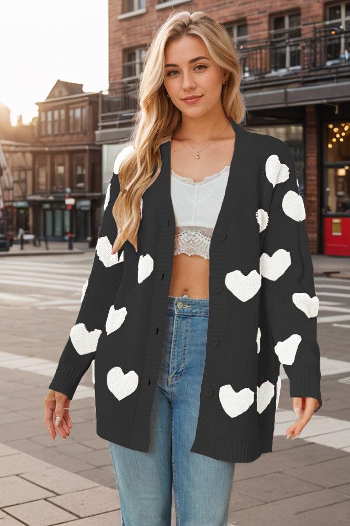 Stijlvol damesvest met unieke hartjesprint, gebreid en modieus voor zowel casual als urban outfits.