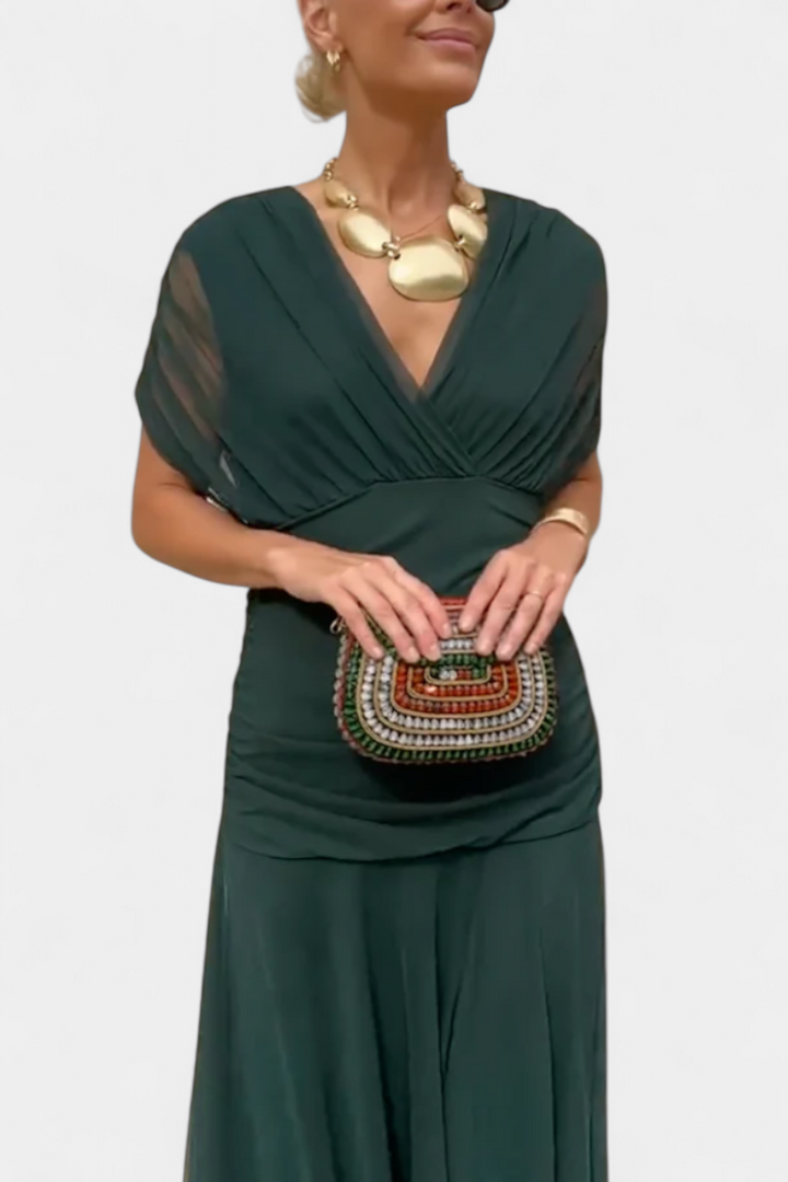 Dames casual V-hals wikkel midi-jurk. Combineert comfort met elegante stijl.