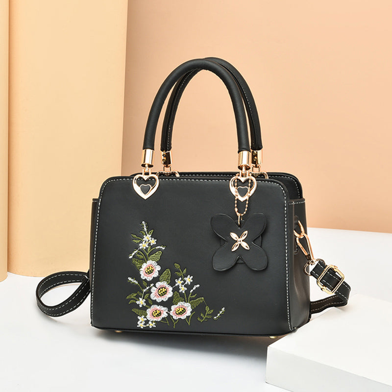 Veelzijdige Flora crossbody tas voor dames, met prachtig elegant borduurwerk. Praktisch en chic.