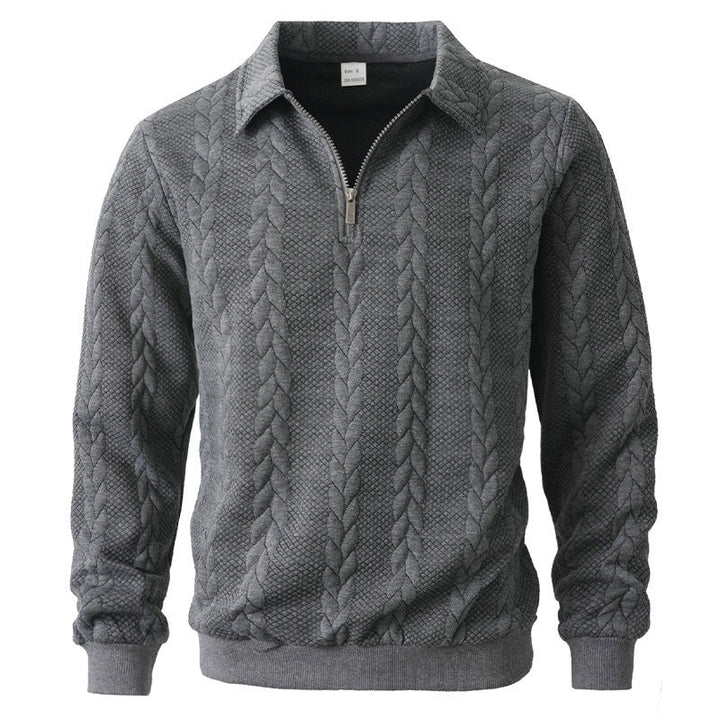 Heren polo shirt met lange mouwen en praktische halve rits; voorzien van een elegant kabelpatroon voor een chique look.