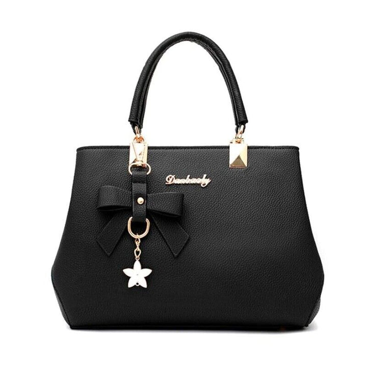 Blauwe dames handtas van kunstleer, stijlvol crossbody model met elegante strik, een tijdloos accessoire.
