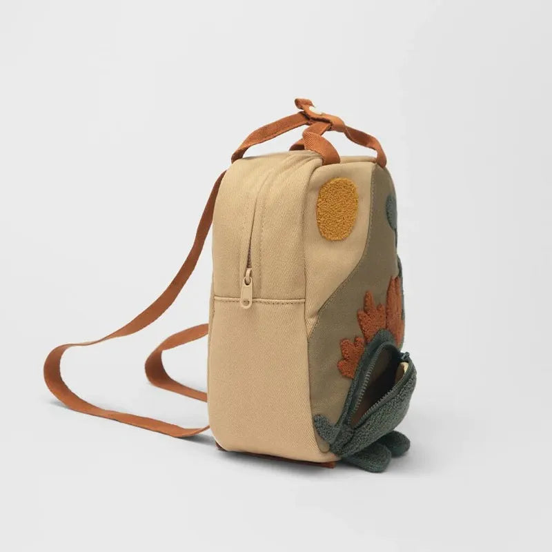 Handige personaliseerbare kinderrugzak met dinosaurus, geschikt voor jongens en meisjes als schooltas.