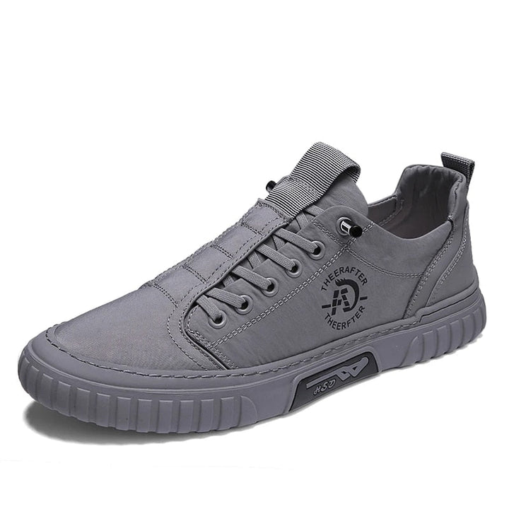 Heren casual sneakers in grijs/zwart, comfortabel en modern, perfect voor dagelijkse stijl in lente en herfst.