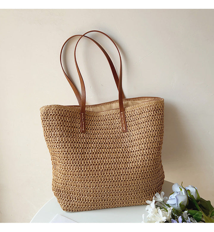 Unisex geweven korbtas met comfortabele handvatten, ideaal voor zomer en dagelijks gebruik.