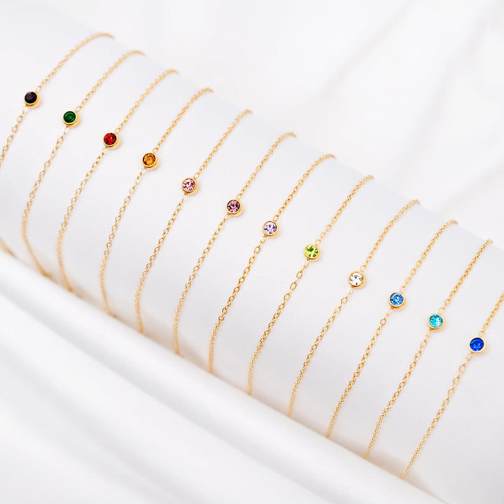 Verstelbare gouden geboortesteen armband voor dames, uniek en persoonlijk cadeau idee.