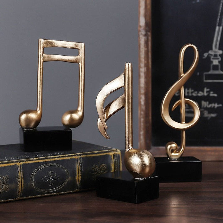 Chique gouden muzieknoot beeldje, een decoratief ornament voor bureau, kast of andere interieurplanken.