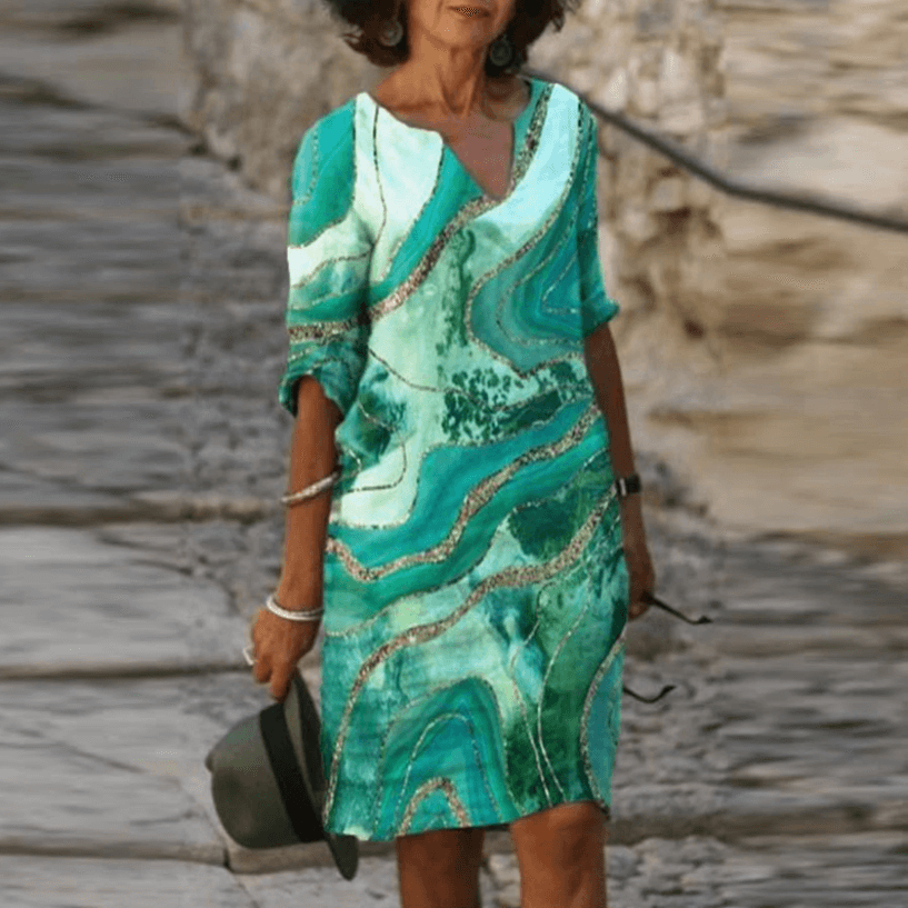 Casual zomerjurk: dames vintage model met driekwart mouw, A-lijn en frisse bloemenprint.