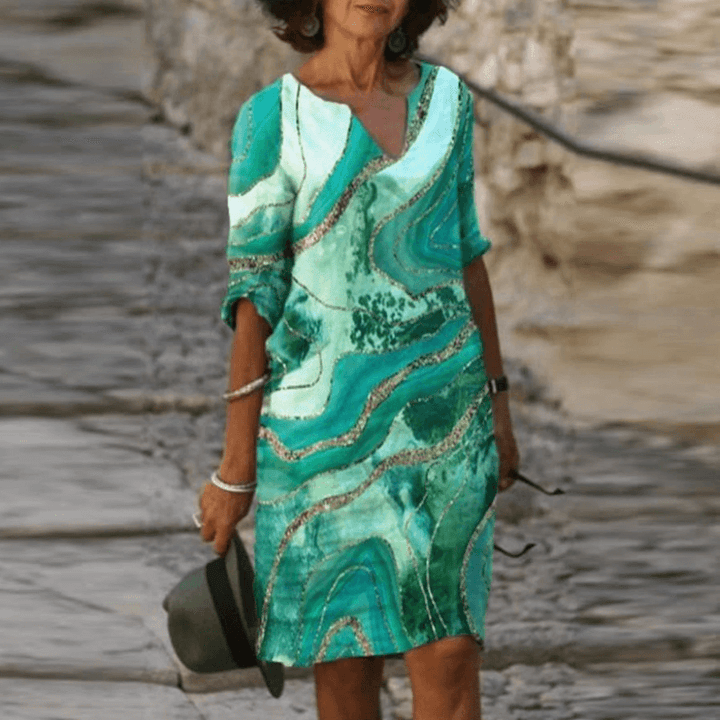 Casual zomerjurk: dames vintage model met driekwart mouw, A-lijn en frisse bloemenprint.