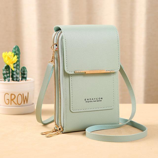 Stijlvolle dames leren telefoonportemonnee met crossbody band. Compacte modieuze tas.