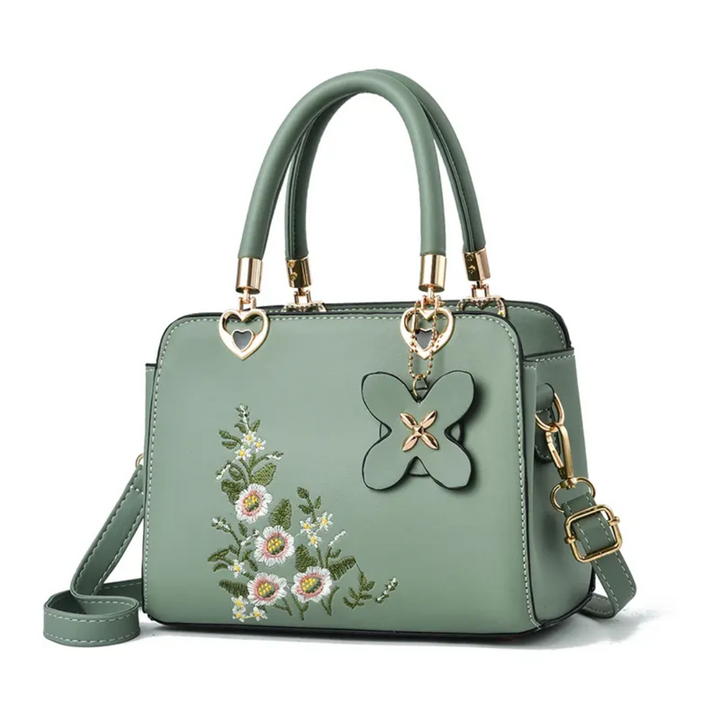Dames Flora crossbody tas met elegant bloemenborduurwerk, een trendy schoudertas accessoire.