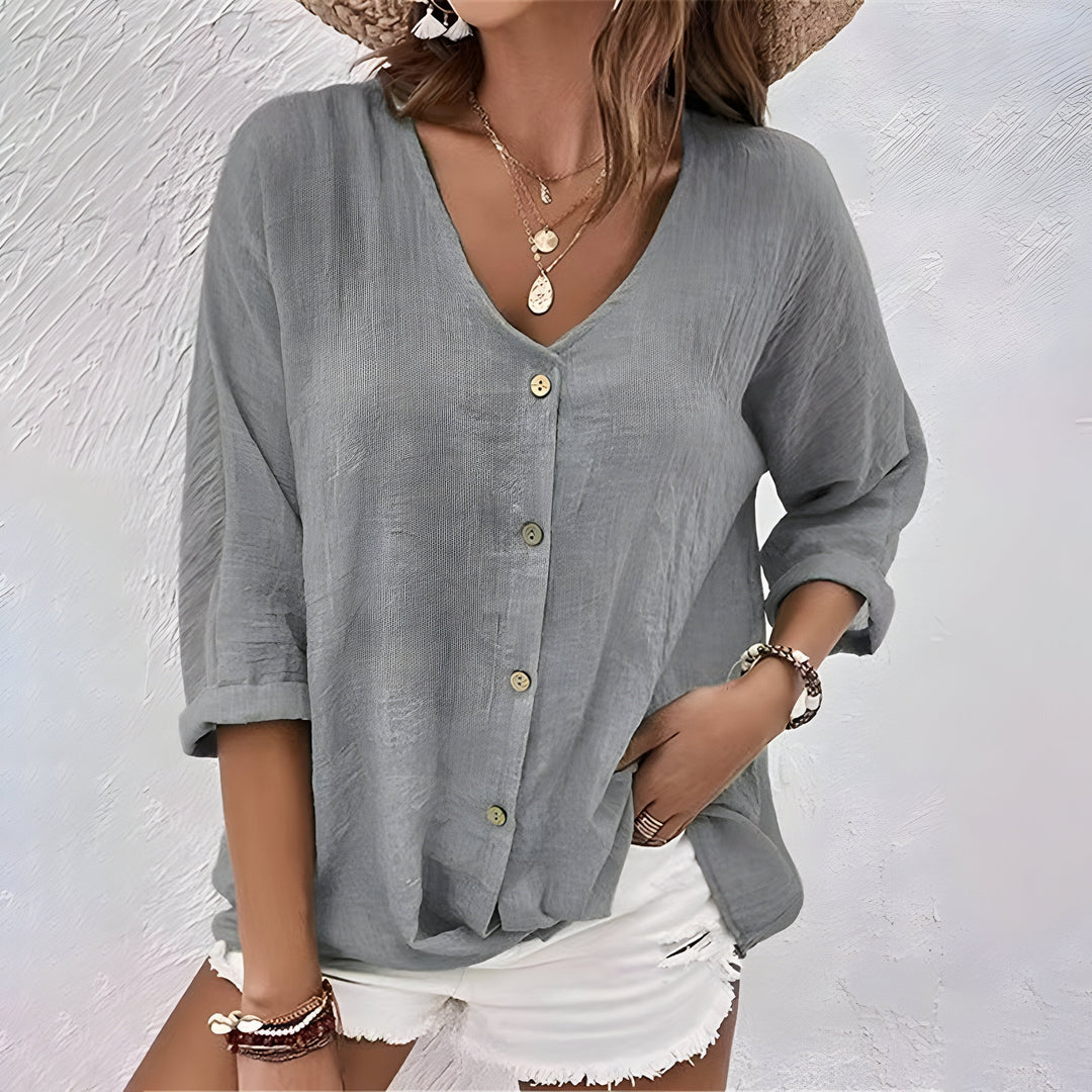 Stijlvolle damesblouse met lange mouwen en V-hals. Een veelzijdige keuze met knoopsluiting voor elke gelegenheid.