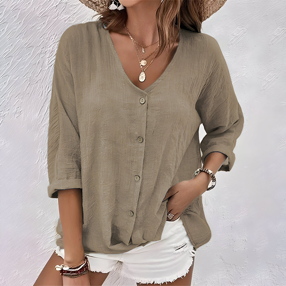 Comfortabele dames top blouse met lange mouwen, V-hals en knoopsluiting. Perfect voor veelzijdige mode.