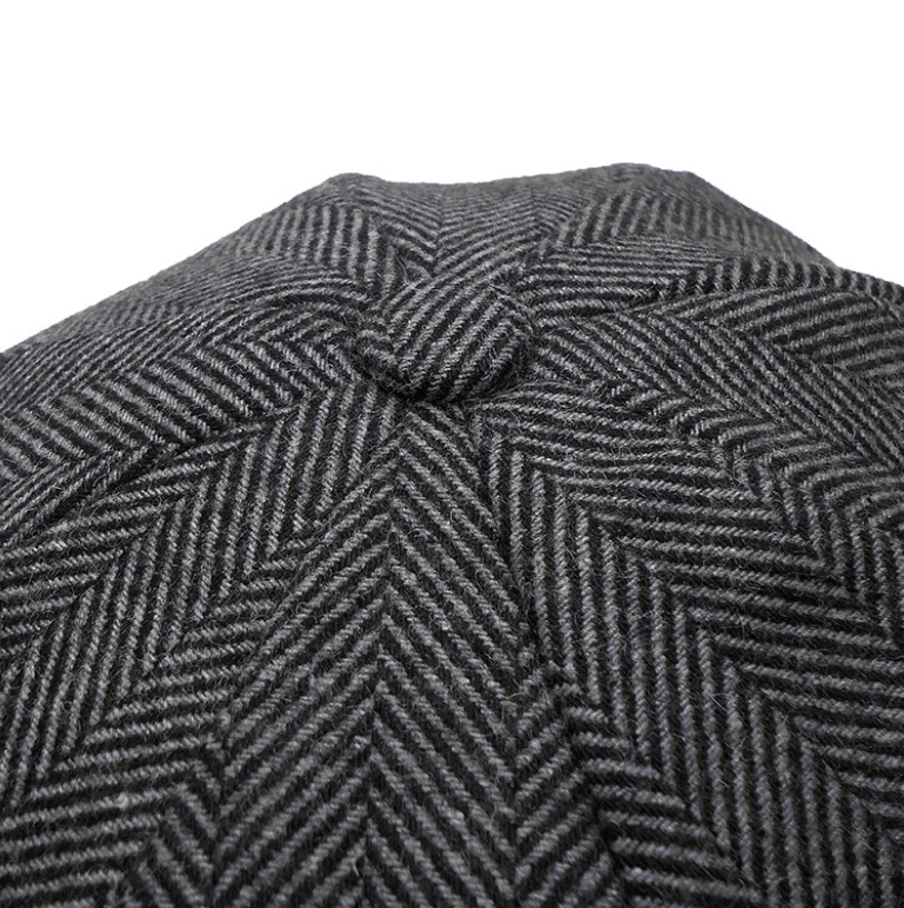 Tijdloze Ierse tweed flatcap, klassieke wollen unisex hoed in grijsbruin, essentieel winteraccessoire.