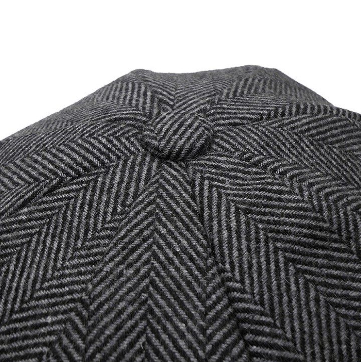 Tijdloze Ierse tweed flatcap, klassieke wollen unisex hoed in grijsbruin, essentieel winteraccessoire.