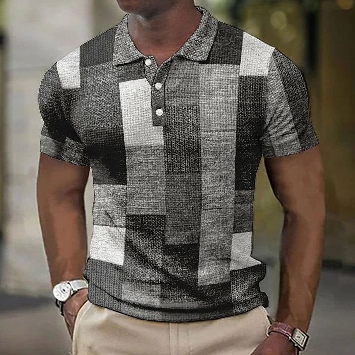 Veelzijdig heren poloshirt met een fris geometrisch colorblock ontwerp. Geschikt voor zowel casual als geklede stijl.